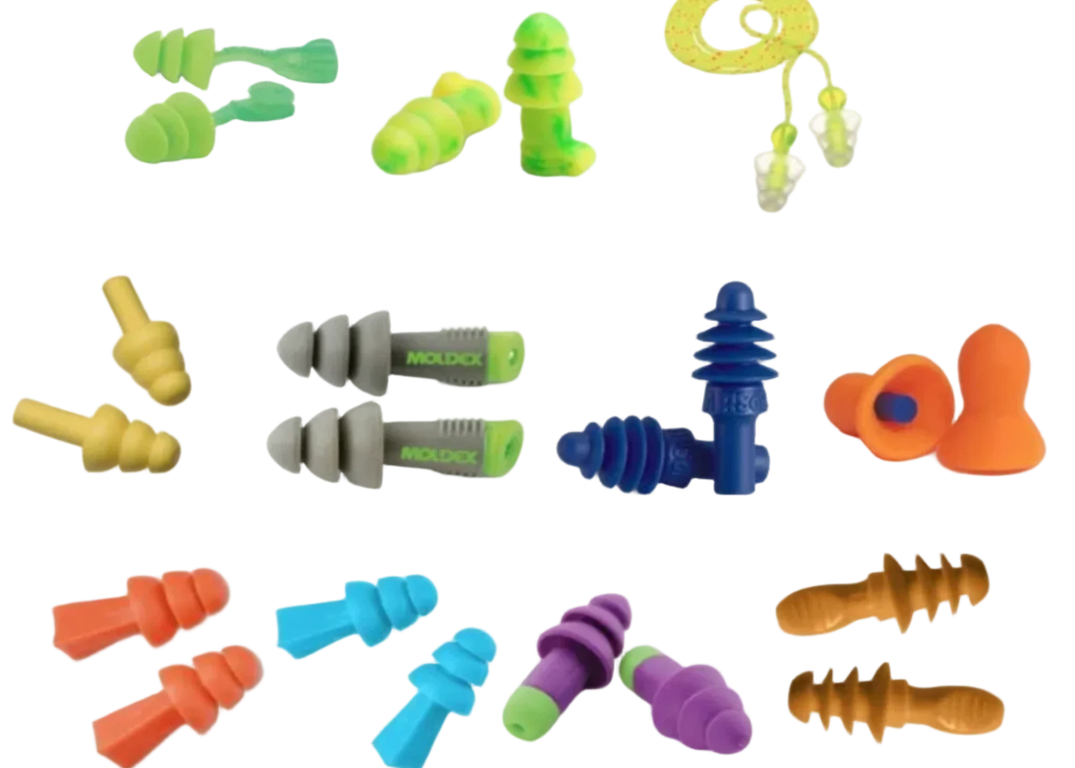 A collection of various noise-isolating and earplugs in multiple colors including orange, blue, green, yellow, purple, and gray, arranged on a plain white background.